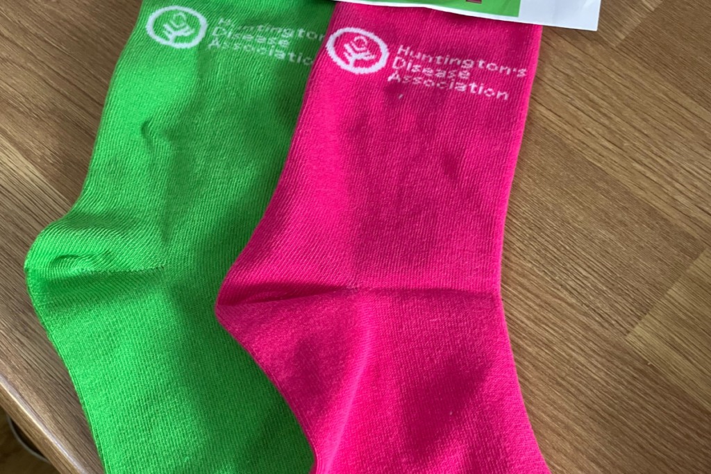 Green and pink sock from the Huntington's Disease Association.